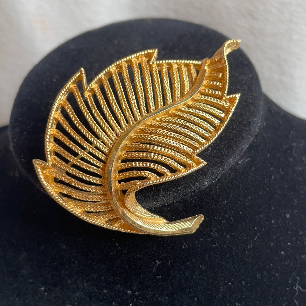B.S.K. Filigree gold tone leaf brooch